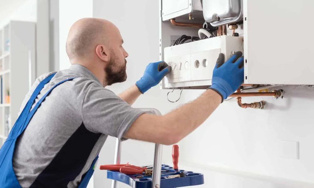 professional-engineer-servicing-a-boiler-at-home.jpg